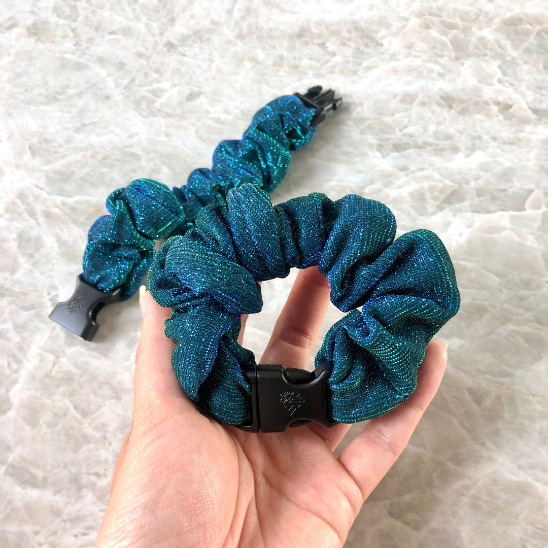 Two teal glitter buckle scrunchies, one buckle scrunchie in hand - the no damage, no pulling, no tangles hair tie and scrunchie hair accessories